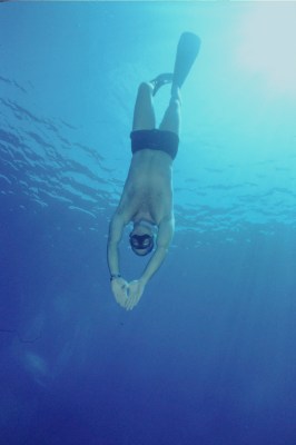 Diver descending in constant ballast